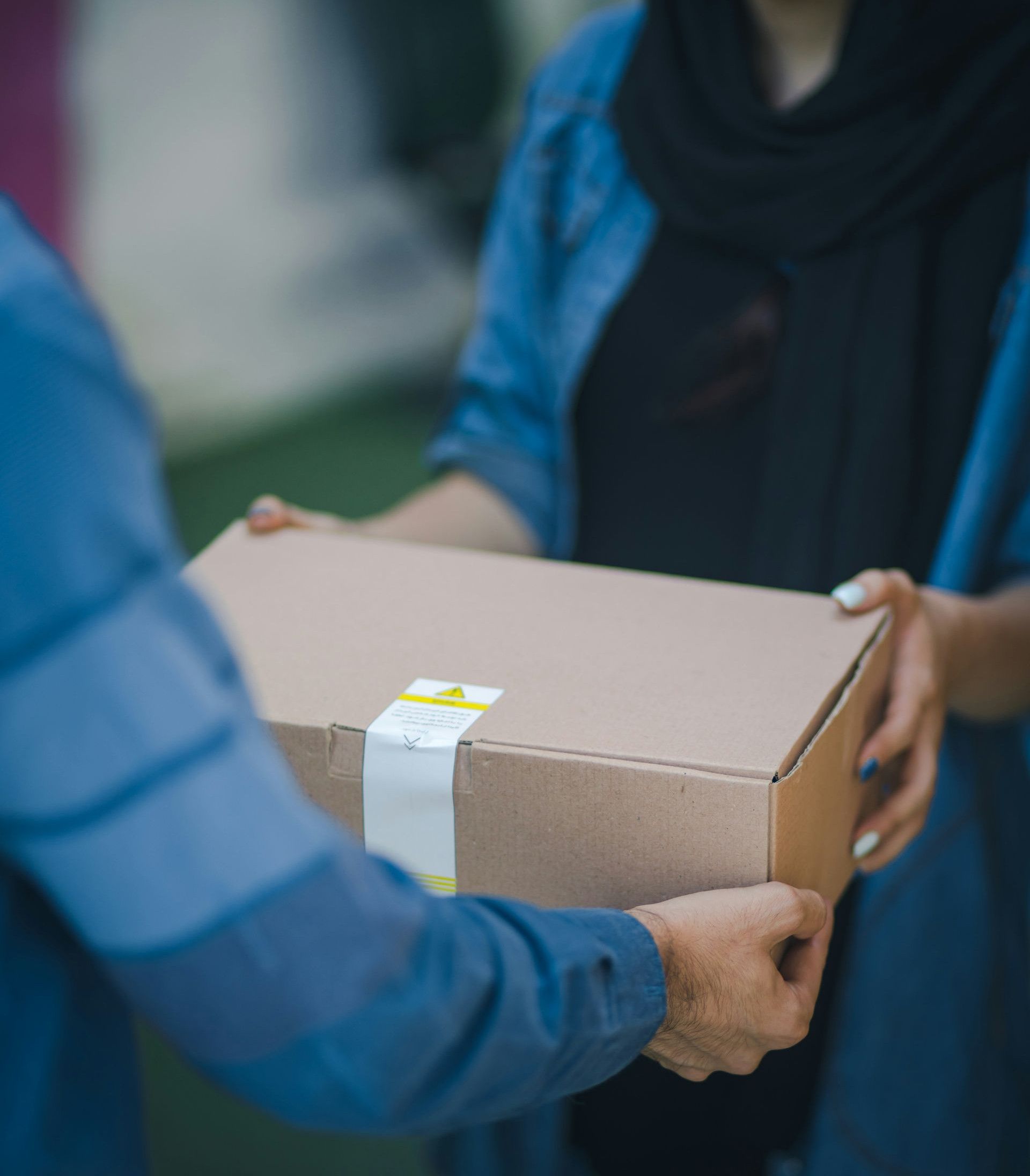 person giving brown box